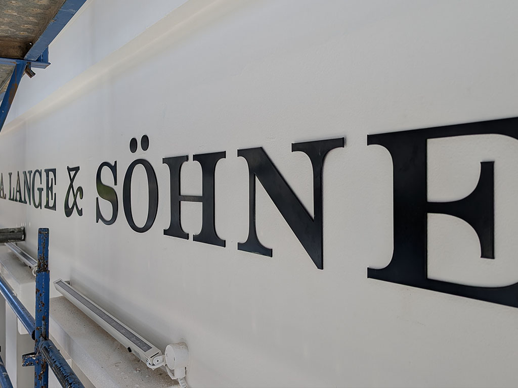 Architectural building signage on exterior facade