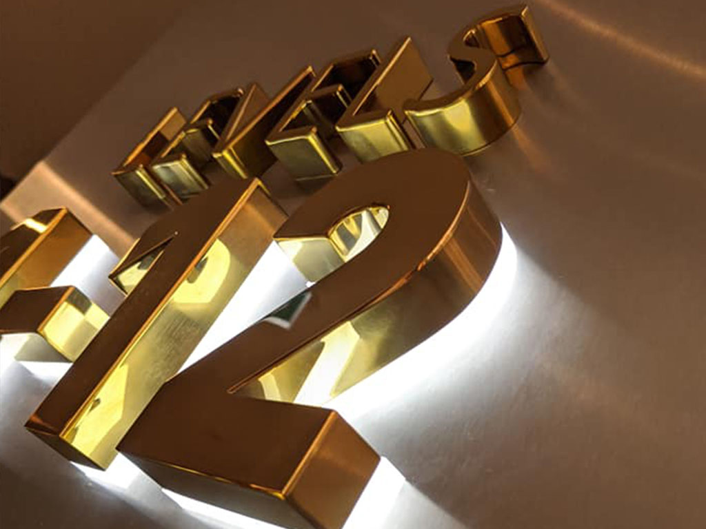Gold 3D fabricated signage with bespoke finish