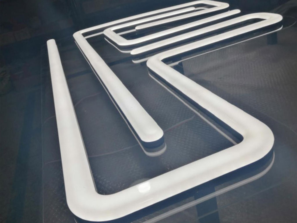 Illuminated 3D fabricated signage (neon)