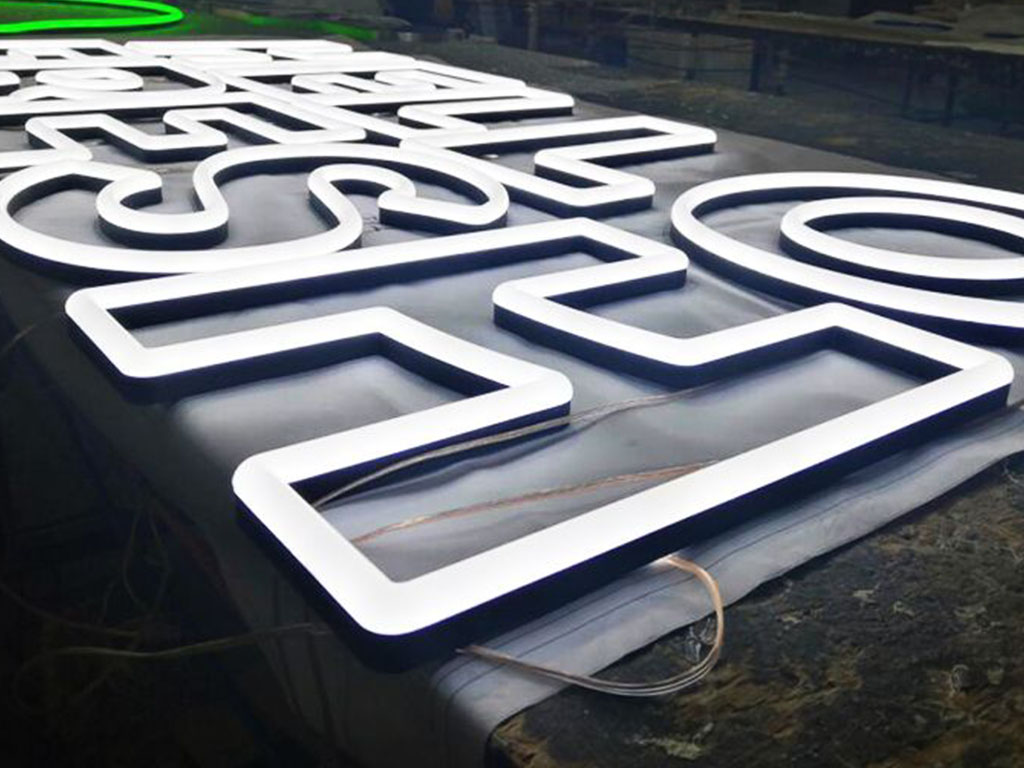 Illuminated 3D fabricated signage (neon)