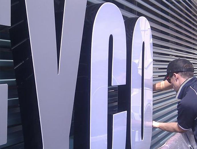 On-site signage installation service at a commercial building